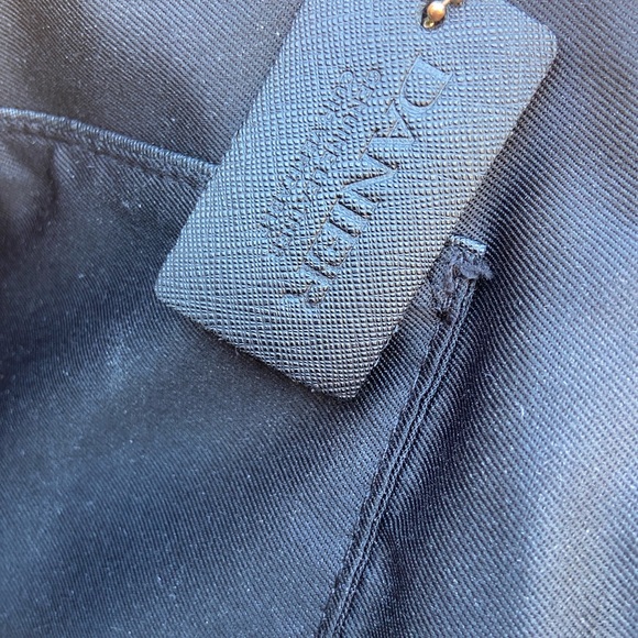 Danier black leather handbag with shiny gold colored accents - Picture 7 of 14